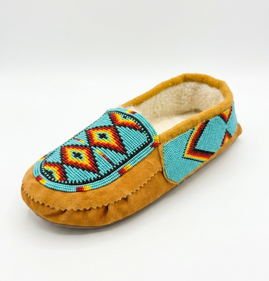 A single tan cow suede moccasin with turquoise and red geometric diamond beadwork and a white fleece lining, shown on a white background.